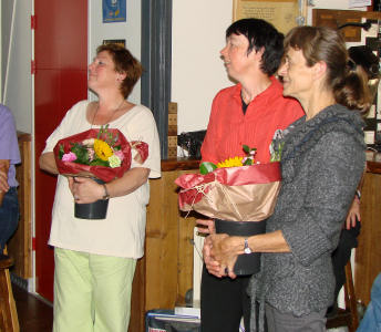 The wives of the committee members are supplied with flowers
