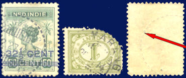 Voorbeelden van beschadigde postzegels