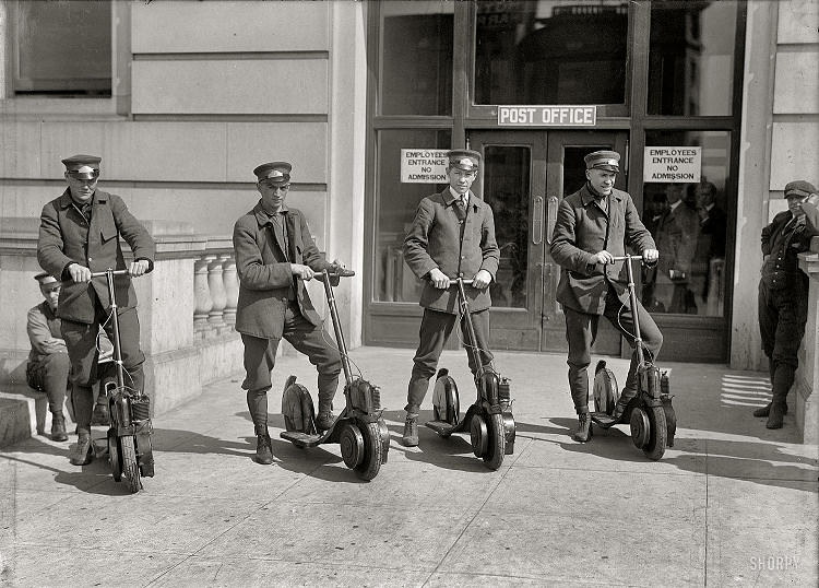 American postmen on Autoped pose forthe picture
