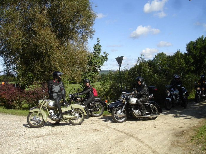The Tuzar family follows on their own motorcycles