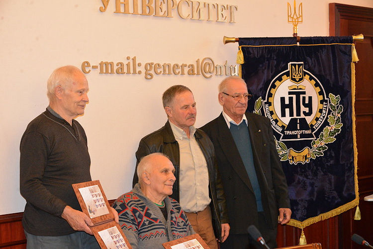 The champions who were present, posing with their stamps